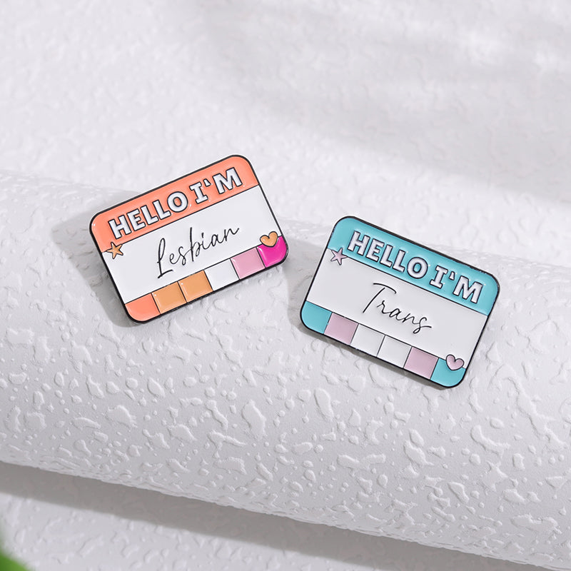 Queer and Here Pins